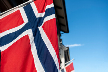 Flag of Norway blowing in the wind, Tromso city - stock photo