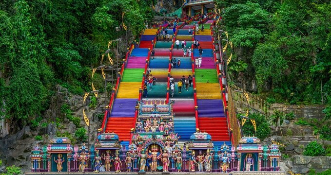 Kuala Lumpur, Malaysia-People climbing the stairs of Batu caves