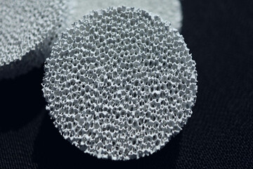 A close up macro shot of a white ceramic coated sponge created by nano technology research and...