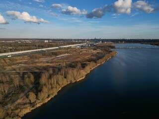 a wide river in an urban area with lots of land
