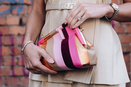 Milan, Italy - February, 23, 2022: woman wears leather Fendi multicolor stripe suede First Small bag, street style details