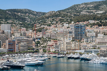 Fototapeta na wymiar Monaco, Monaco - 25 June 2023: View of Port Hercule in Monaco on a sunny day