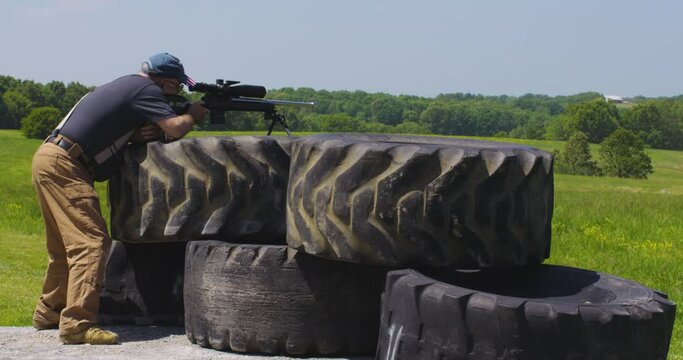 Sharpshooter Takes Aim And Fires Rifle At The Firing Point During Precision Rifle Series Match In Leach, Oklahoma. wide