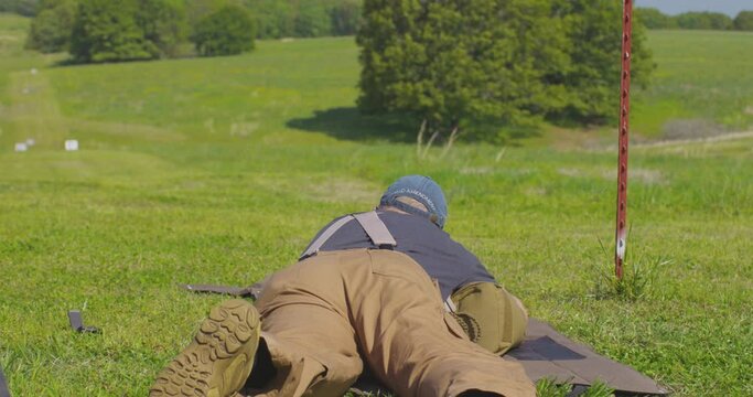 Marksman Aiming To Shoot Target At The Shooting Range. Precision Rifle Series Match In Leach, Oklahoma. wide, tilt-up