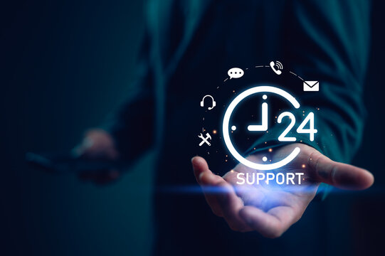 Businessman holding icon virtual 24 support services, worldwide nonstop and full-time available contact of service concept. Assistance customer services, Care and consulting client 24hr, Call Center.