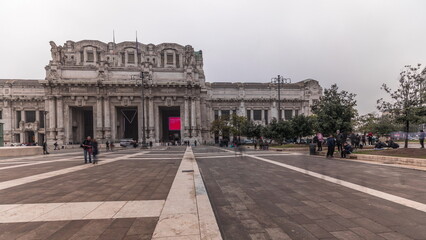 Fototapeta premium Panorama showing Milano Centrale timelapse - the main central railway station of the city of Milan in Italy.