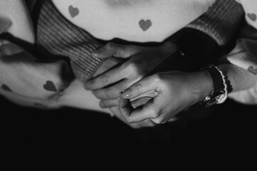 Mother holding hands of daughter