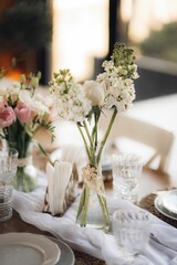 Closeup of fresh flowers in vase on table