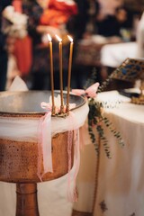 View of glowing handles on silver bowl in church