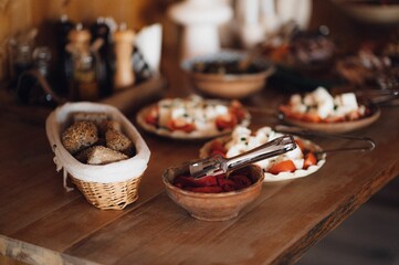Wooden table adorned with a variety of delicious food items