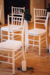 Fototapeta na wymiar Interior of wedding ceremony space with white chairs
