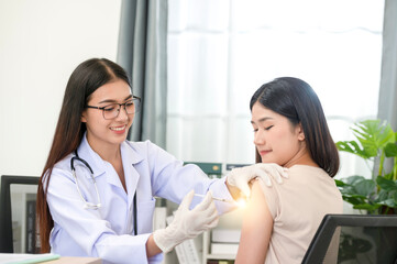 Fototapeta premium Doctor doing vaccination on patient's shoulder, influenza vaccination on arm