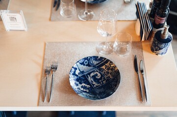 Warm and inviting restaurant interior featuring a stylishly decorated table, with a cozy atmosphere.