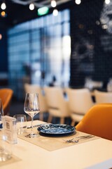Warm and inviting restaurant interior featuring a stylishly decorated table, with a cozy atmosphere.