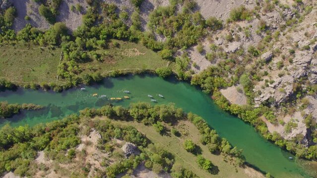 Group yellow and blue boats kayaking on zrmanja river Croatia, aerial