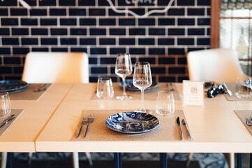 Warm and inviting restaurant interior featuring a stylishly decorated table, with a cozy atmosphere.