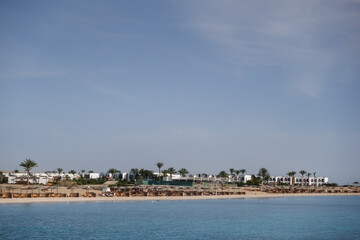 buildings palm trees and the beach from a resort in marsa alam on vacation