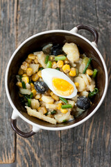 Potato salad with egg and olives