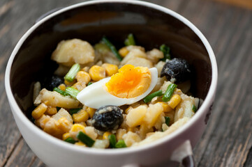 Potato salad with egg and olives