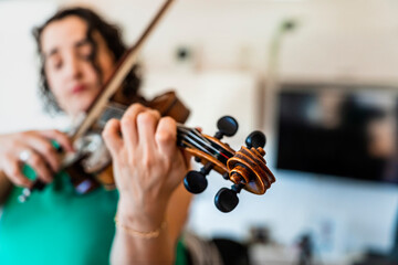 Musical Inspiration: Young Violinist Nurturing Her Talent with an Old Violin