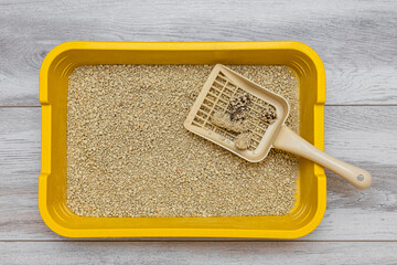 scoop for cleaning cat litter with waste.