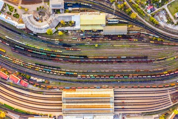 Expansive train track populated with a variety of trains in motion