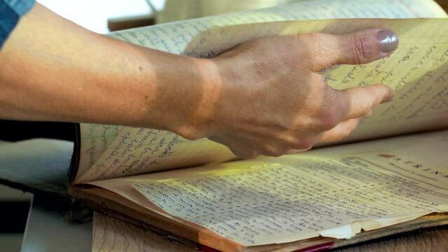Detail plan, old recipe book leafing through.