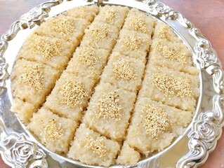 Delicious Thai sweet food traditional dessert stick rice with sugar coconut 