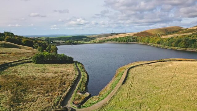 Cinematic, aerial clip of Ogden Reservoir, Oldham, on the edge of the Pennines.