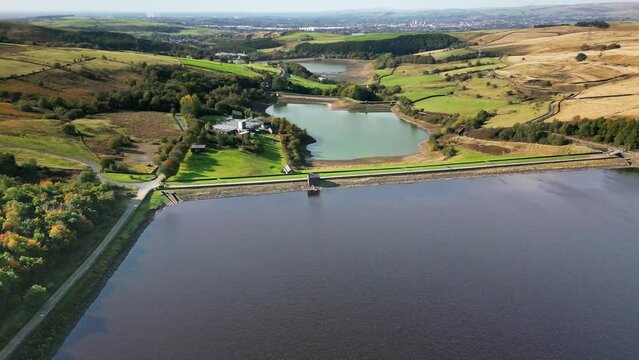 Cinematic, aerial clip of Ogden Reservoir, Oldham, on the edge of the Pennines.