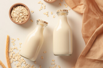 Generative AI. Vegan oat milk, non dairy alternative milk. Oat milk in glass bottle with flakes and spike or ears of grain