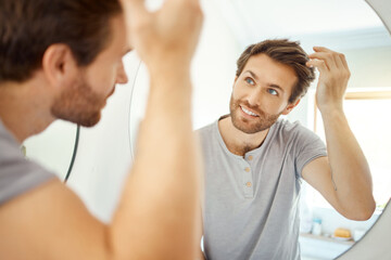 Bathroom, mirror reflection and happy man with hair care routine for maintenance, beauty process or...
