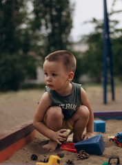 little child playing with toys