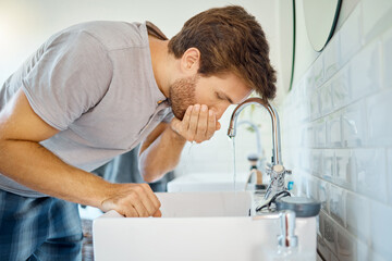 Man in bathroom, mouth wash and water with morning routine, health and wellness in home. Dental care, cleaning teeth and face with male grooming for fresh breath, hygiene and getting ready in house.