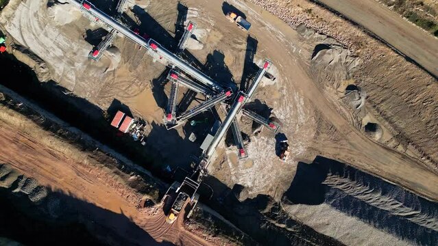 Top down aerial clip of a large open cast mine, quarry.