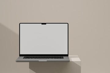 Laptop on beige block - obrazy, fototapety, plakaty
