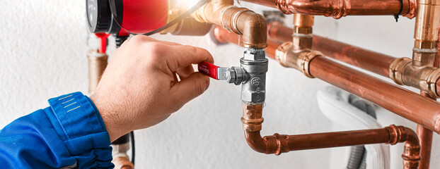 Plumbing concept or service water worker. copper pipeline with preassure gauge.