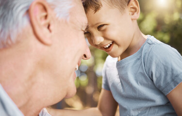 Children, camp and a grandpa hiking with his grandson outdoor in nature for bonding, travel or...