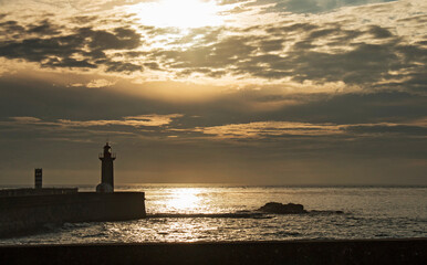 Lighthouse and sunset on the coast of Porto, Portugal - 618118734