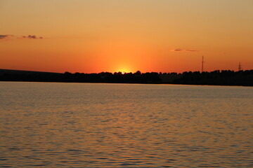 A body of water with land in the background © parpalac