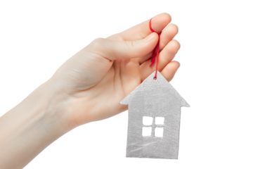 Decorative house in hand on a white background.