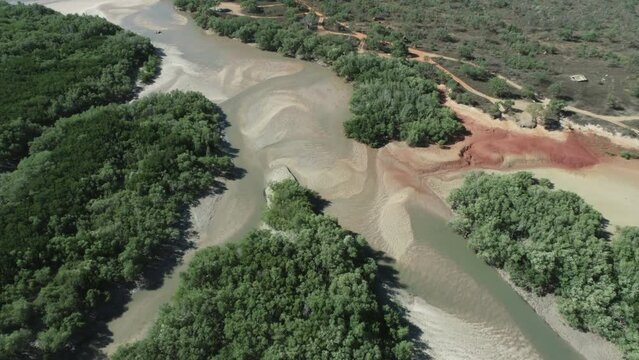 Coastal Kimberley region of Australia tidal mud flats and ocean. Abstract aerial drone patterns and shapes Roebuck Bay Broome 4K.