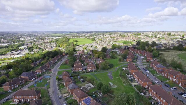 Aerial View of a typical UK town, suburb district sowing housing, gardens and roads.
