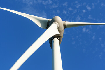 detail of  wind turbine blases and pivit high in the sky