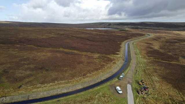 Aerial drone, cinematic footage of a country winding road on Saddleworth Moor