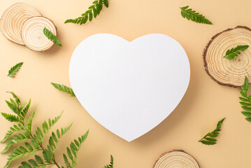 Fototapeta na wymiar Beautiful fern branches concept. Top view photo of white empty heart-shaped frame surrounded by branches of fern and wooden round pieces on isolated beige background with copy-space