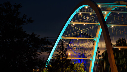 BRIDGE OVER THE RIVER - An object of urban infrastructure in night illumination