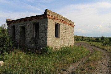 A building with a dirt road