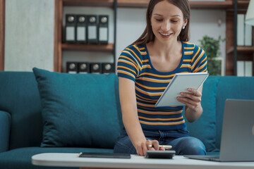 Pretty caucasian student sitting on sofa, Self study during quarantine, self-study is a method of learning where students take charge of their own studying outside of the classroom