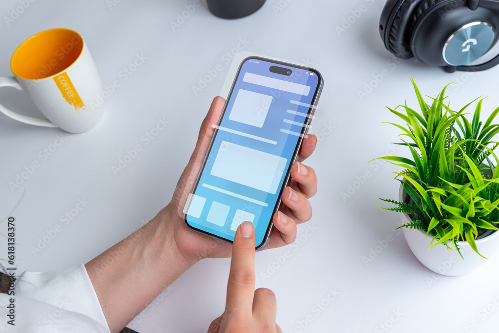 Poster Woman holding a smartphone with a conceptual user interface. The interface showcases a clean design with vibrant colors and intuitive navigation elements